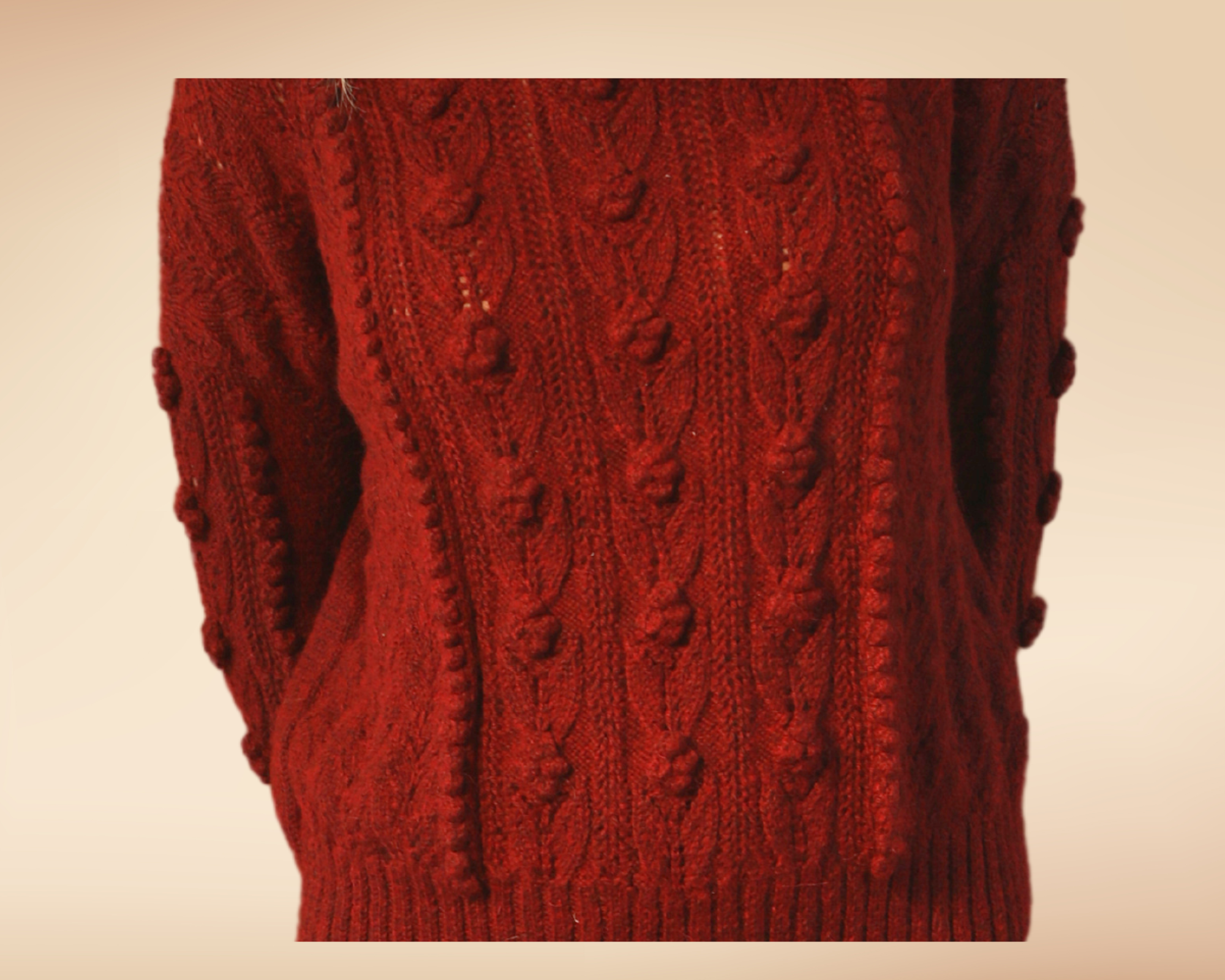 Detail view of the ose sweater showing the leaf and rose stitches 