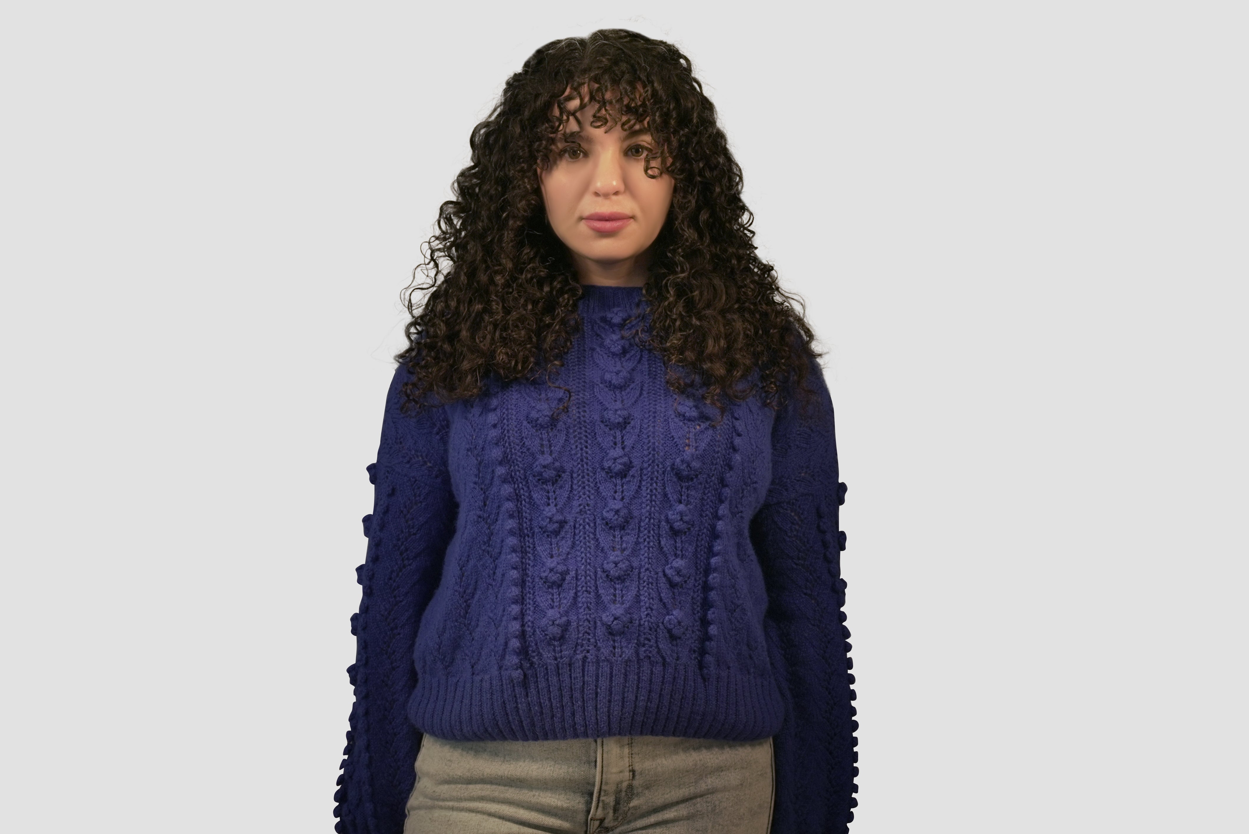 Front view of the Rose Sweater showcasing intricate rose and leaf stitch details.