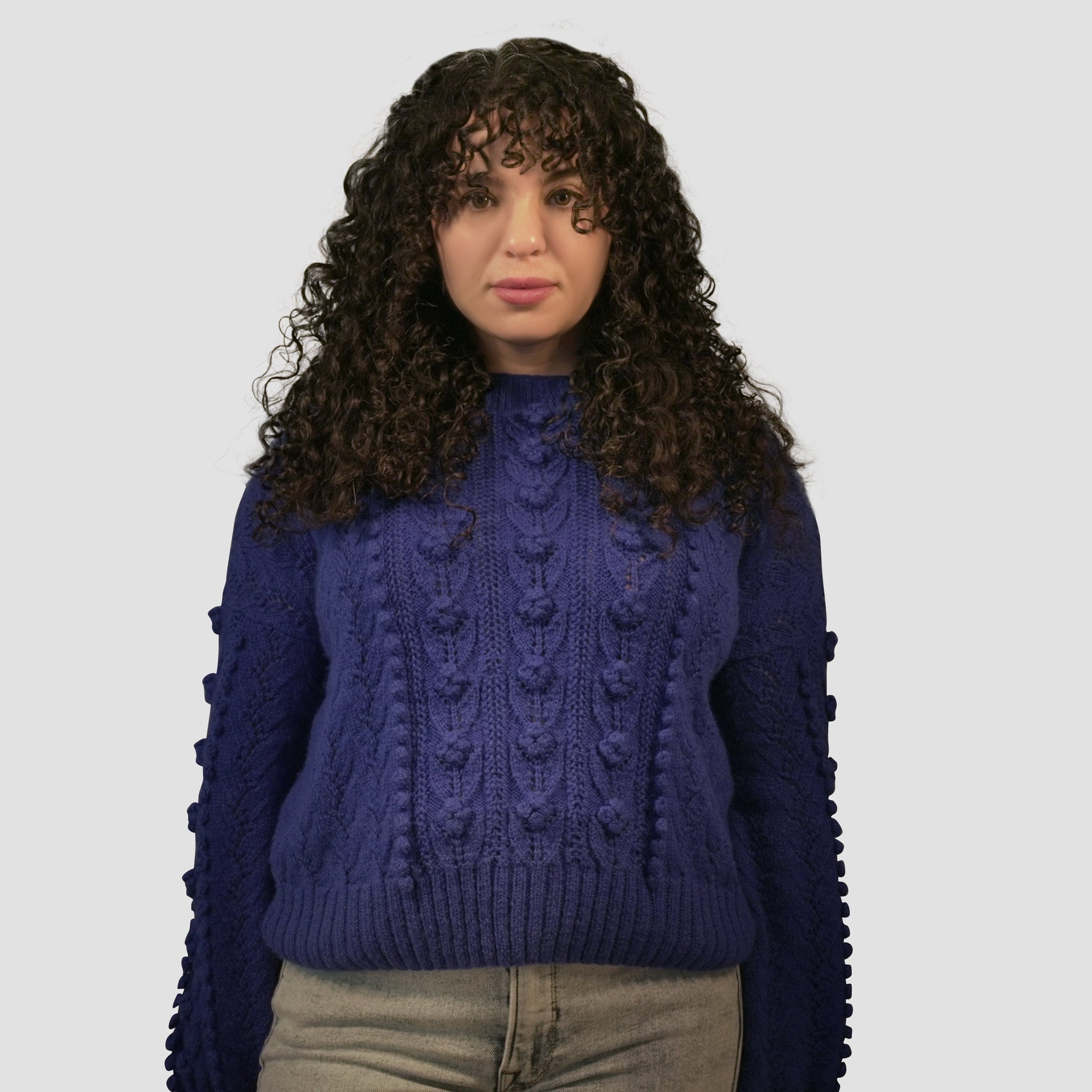 Front view of the Rose Sweater showcasing intricate rose and leaf stitch details.