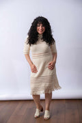 A front view of the white ella dress showcasing it's fitting and details. 