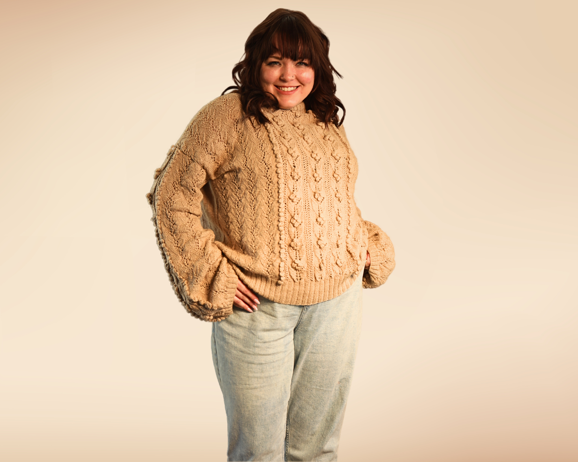 Gigi standing with the rose sweater in full view