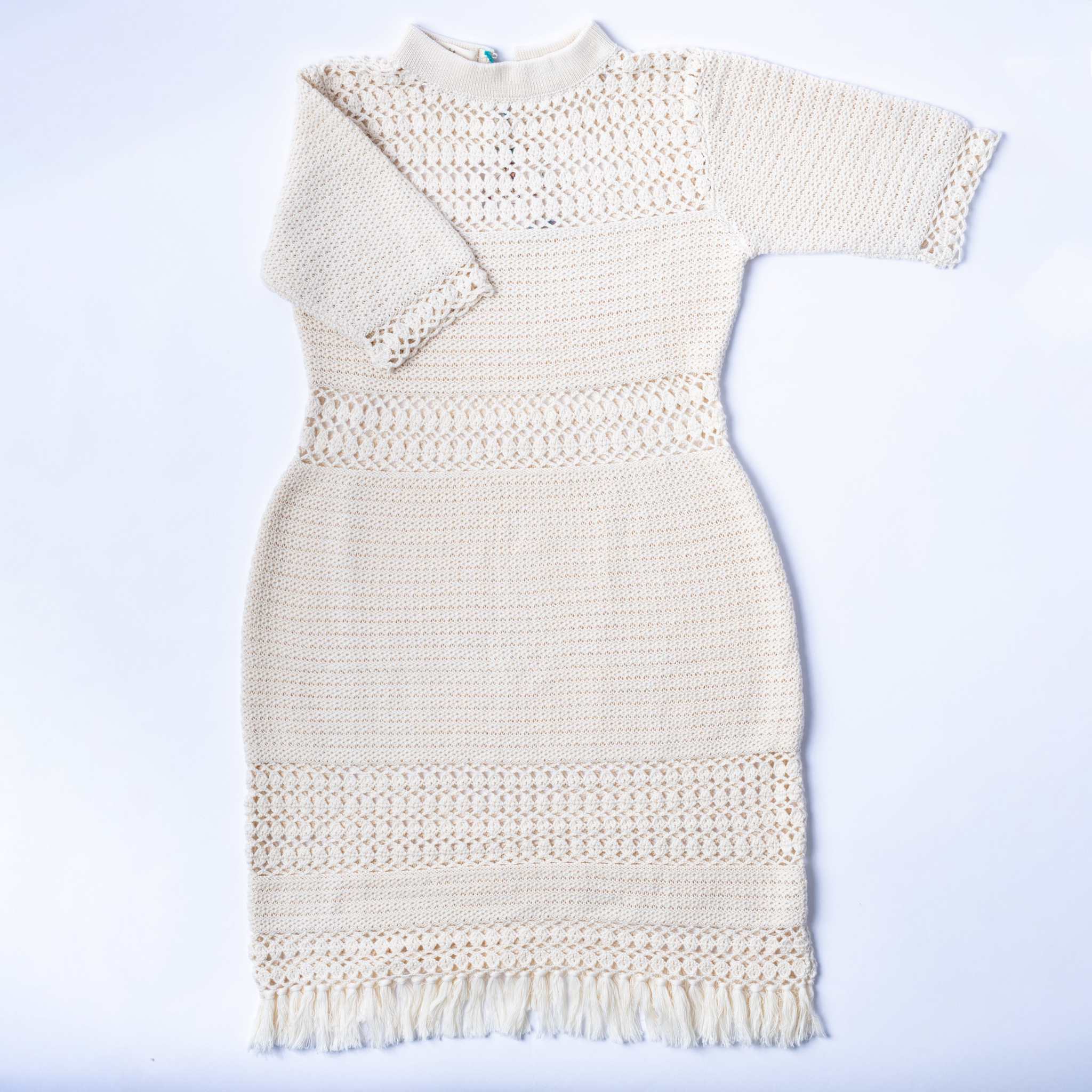 Front flat view of the white ella dress showcasing its details.