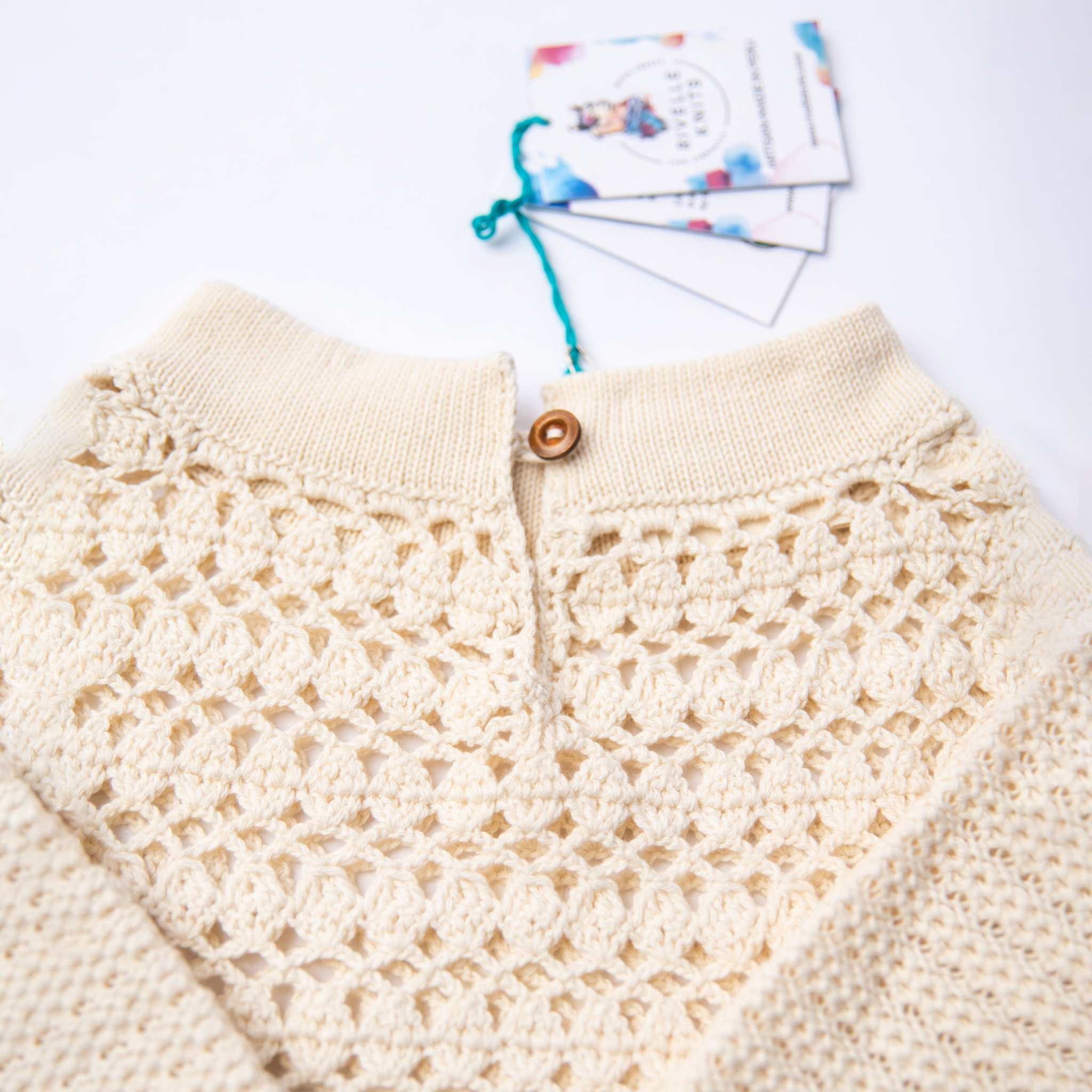 Close-up of the crochet neck design on the White Ella Dress.